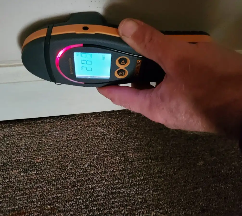 Moisture detection at baseboard during Storm Damage Restoration in West Whiteland